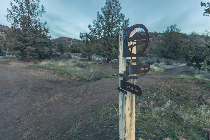 Baby Burma and Canal Trail fork with metal mountain sign 
