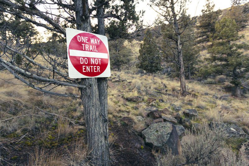 One Way Trail - Do Not Enter sign on a juniper tree